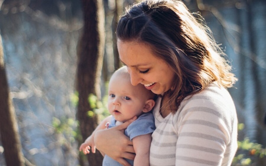 mother holding baby