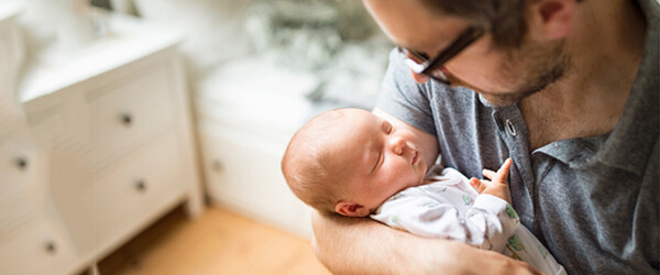 father holding child